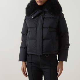 Model wearing Yves Salomon Cropped Down Jacket in black with removable shearling collar, styled with black trousers