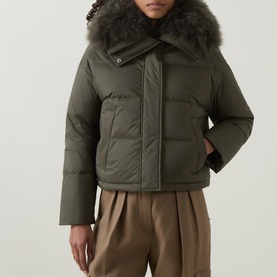 Model wearing Yves Salomon Cropped Down Jacket in Herbal Tea with removable shearling collar, styled with taupe wide-leg trousers