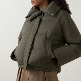 Model wearing Yves Salomon Cropped Down Jacket in Herbal Tea, showing removable shearling collar, front zip fastening and welt pockets