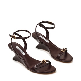 Steve Madden brown leather strappy wedge sandals with ankle strap, gold-tone buckle detail, and sculpted wedge heel