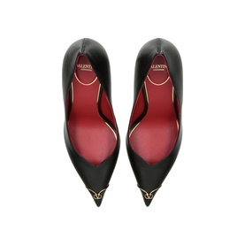 Valentino black pointed-toe pumps, overhead view showing red leather lining and gold VLogo detail at toe