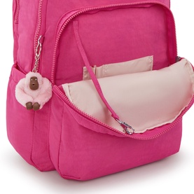 Kipling Intense Rose backpack with open front pocket revealing pale pink interior lining and signature monkey keyring charm.