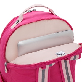 Kipling backpack in Intense Rose, open to reveal padded laptop sleeve and striped interior lining with logo tag.