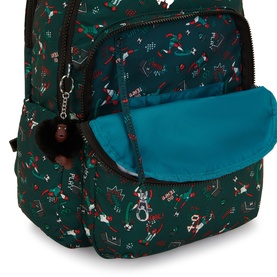 Kipling backpack in Soccer Prt print, open top view showing teal interior lining, with monkey keyring charm and multi-pocket design.