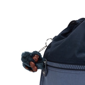Kipling bag in blue with signature monkey keychain, silver-tone zip detail visible in close-up shot