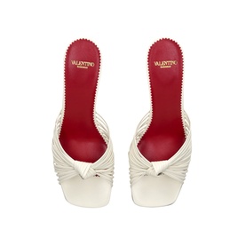 Valentino white leather knotted strap heeled mules with square toe and red insole, overhead view