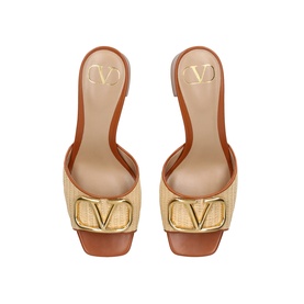 Valentino VLogo raffia mule heels in natural and tan, featuring oversized gold-tone VLogo buckle detail and block heel