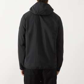 Model wearing Barbour International Dalliston Logo Jacket in black, rear view showing hood, zip fastening and showerproof polyamide construction.