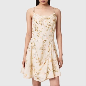 Model wearing All Saints Claire Floral Mini Flared Dress in caramel off-white with gold floral print, cowl neckline, and adjustable double straps