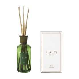 Culti Milano reed diffuser in dark green glass bottle with natural reeds, shown alongside white gift box packaging