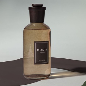 Culti Milano reed diffuser in amber glass bottle with black cap and natural reed sticks, home fragrance lifestyle gift