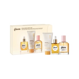 Gisou Hair Care Set containing four products including hair oil, serum and cream, presented in a yellow gift box