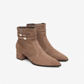 Brown suede ankle boots with pointed toe, block heel, and gold-tone buckle strap detail, side zip fastening