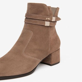 Brown suede ankle boot with block heel, double strap buckle detail in gold-tone hardware and square toe.