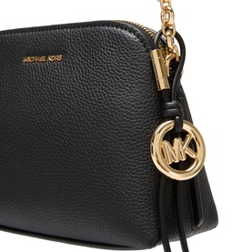 MMK black crossbody bag with gold-tone MK logo charm, tassel detail, and zip closure on pebbled faux leather