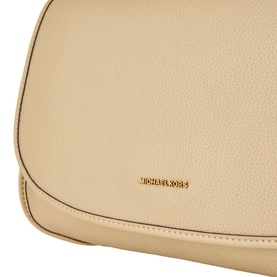 Michael Kors khaki leather crossbody bag, close-up of flap with gold logo lettering detail