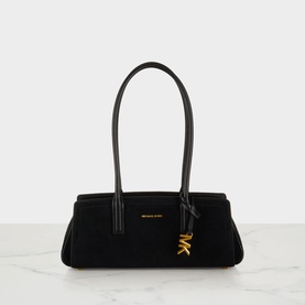 MMK Laila Tote Bag in black suede with single top handle, gold-toned MK hanging charm, and zip fastening
