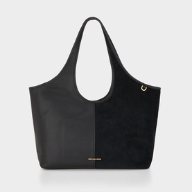 MMK black leather tote bag with suede panel, gold-tone hardware detail, and wide shoulder straps