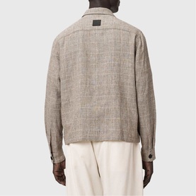 Model wearing All Saints Keal Check Jacket in sediment brown, linen-viscose blend, rear view showing checked pattern and leather branded patch.