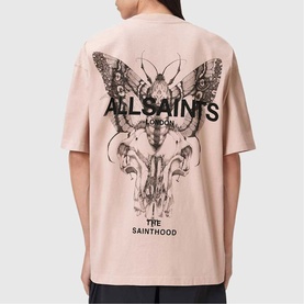 Model wearing All Saints Hallis Oversized Graphic Logo T-Shirt in Sunbaked Pink, back view showing butterfly skull graphic print.
