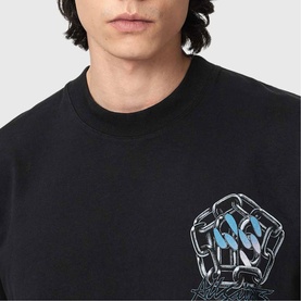 Model wearing black crew neck sweatshirt with metallic chain and blue graphic print on chest