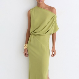 Model wearing Reiss green one-shoulder draped midi dress with side split, styled with a gold cuff bracelet.