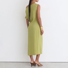 Model wearing Reiss green sleeveless midi dress, shown from behind, styled with gold cuff bracelet and nude heeled mules