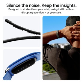 Model wearing a black and blue fitness tracker band on wrist, shown in active lifestyle setting with close-up strap detail