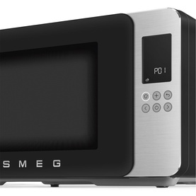 Smeg Microwave Grill in matte black with stainless steel front panel, digital display, and touch control buttons, angled side view.