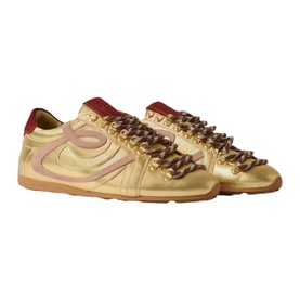 Claude Pierlot metallic gold leather trainers with pink stripe detail, chain-style laces and red heel tab, gum sole