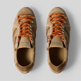 Claude Pierlot women's trainers in clear beige suede with orange laces, viewed from above on grey background