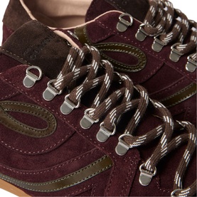 Claude Pierlot red suede trainers close-up, showing olive contrast panels, metal eyelets and brown striped laces