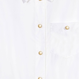 Maje white womenswear shirt with metallic gold press-stud buttons and chest pocket, close-up detail view