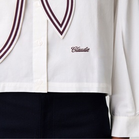 Claude Pierlot Womens French Dress in clear white with burgundy V-neck stripe trim and embroidered logo, styled with navy trousers