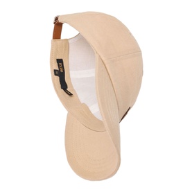 Maje baseball cap in clear beige, underside view showing white lining, brown leather adjuster strap and branded label.