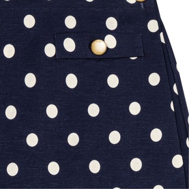 Maje Womens French Dress in navy dots print, close-up of cream polka dot fabric with gold button pocket detail