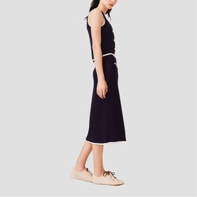 Model wearing Maje Womens French Dress in navy with white trim detail, styled with beige espadrille flats