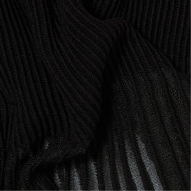 Claude Pierlot Rib Knit Top in black, close-up showing ribbed opaque bodice detail and sheer pleated lower section texture.