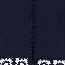 Maje navy womenswear with zip-front detail and white floral crochet hem trim.