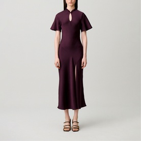 Model wearing Claude Pierlot Womens French Dress in Dark Dahlia, midi length with flutter sleeves, keyhole neckline and front split, styled with