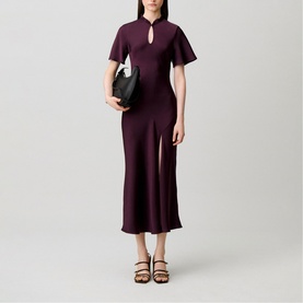 Model wearing Claude Pierlot Womens French Dress in Dark Dahlia, a deep plum midi with keyhole neck, flutter sleeves and side split, styled with
