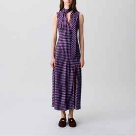 Model wearing Claude Pierlot Womens French Dress in burgundy print, sleeveless maxi with high neck tie detail and flared skirt