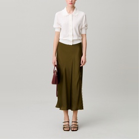 Model wearing Claude Pierlot Womens French Dress in brown, styled with a white short-sleeve shirt, heeled sandals, and a burgundy bag.