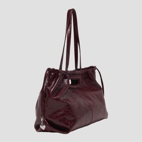 Maje tote bag in deep burgundy patent leather with dual shoulder straps and silver-tone hardware detail