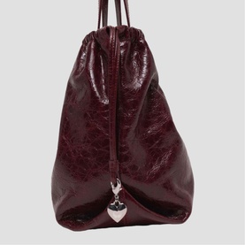 Maje burgundy patent leather drawstring bag with silver heart charm pendant and dual top handles