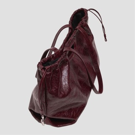 Maje burgundy crinkled leather tote bag with ruched drawstring top, double handles, and silver zip detail