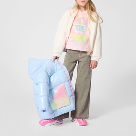Model wearing Billy Blush blue padded coat, styled with pink graphic tee, wide-leg trousers, and pink trainers