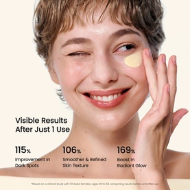 Model applying Biodance Day Cream under eye, smiling. Text overlay shows skin results: 115% dark spots, 106% texture, 169% glow.