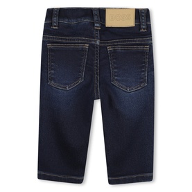 Boss Kids Baby stone pulverisation jeans, rear view showing five-pocket style, contrast stitching, and gold-tone logo patch at waistband