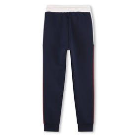 Navy blue joggers with white waistband and red side stripe detail, elasticated cuffs